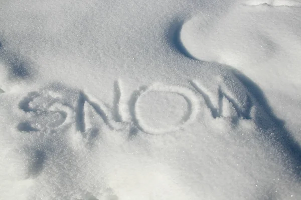 close-up photo of text Writing In The Snow