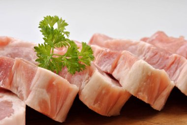Some Raw Organic Pork Chop And Parsley