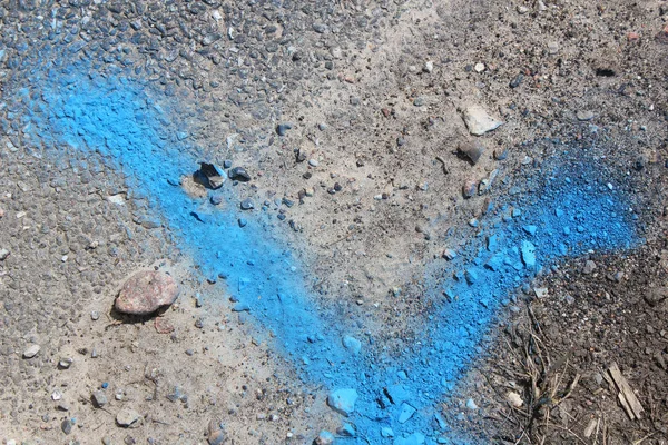 blue mark on asphalt , top view