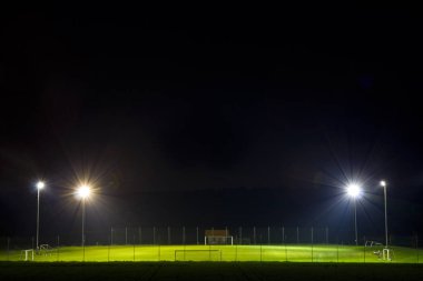Lighted Empty Soccer Field In The Night clipart