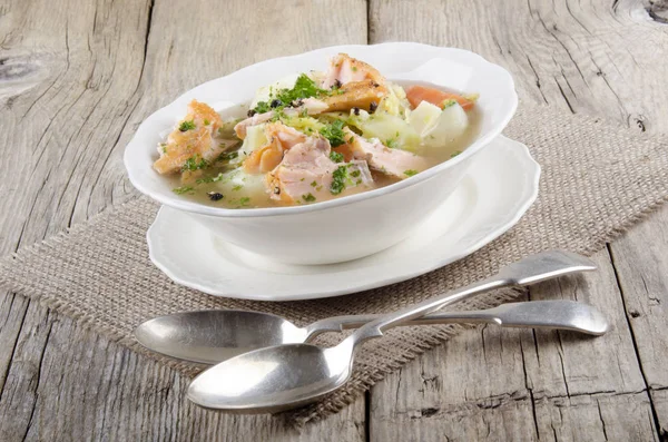 irish soup with salmon stew in white bowl