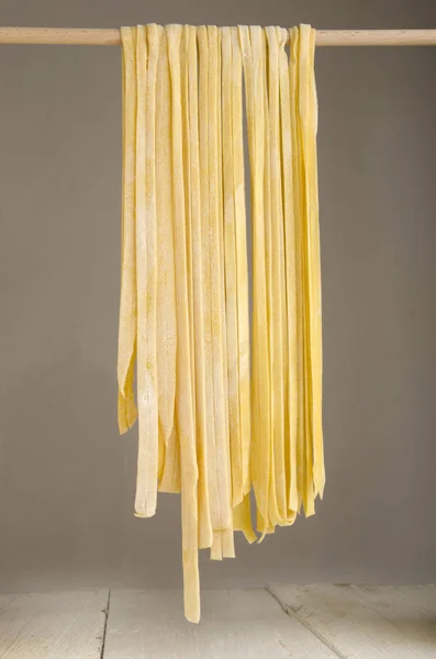 Fresh Homemade Tagliatelle Hanging Wooden Stick Dry — Stock Photo, Image