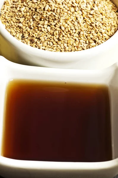 Sesame Oil And Sesame seeds close up shot