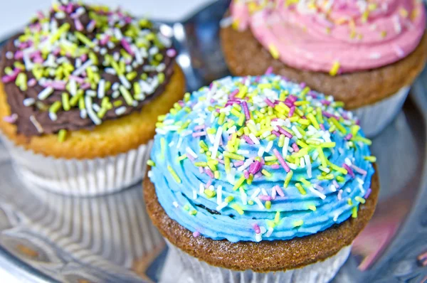 Muffins Decorated With Blue Cream