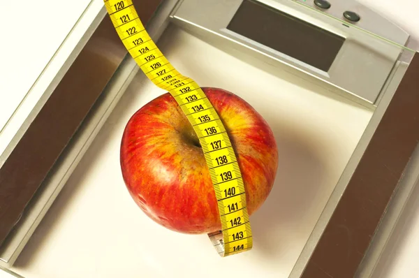 Bathroom Scales Measure Apple Royalty Free Stock Images