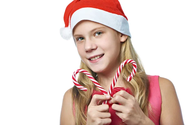 Girl in red cap with christmas candy cane isolated — Stock Photo, Image