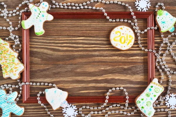 Christmas cookies and wooden frame — Stock Photo, Image