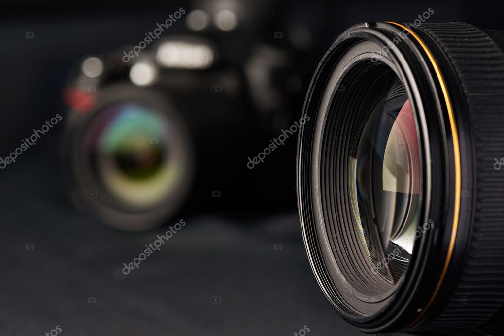 Photo lens on blurred camera — Stock Photo © ryzhov #128778814