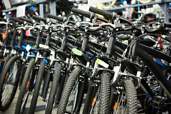 Modern mountain bikes in shop — Stock Photo, Image