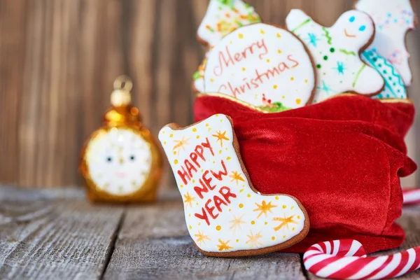 Christmas gingerbread and toy alarm clock — Stock Photo, Image