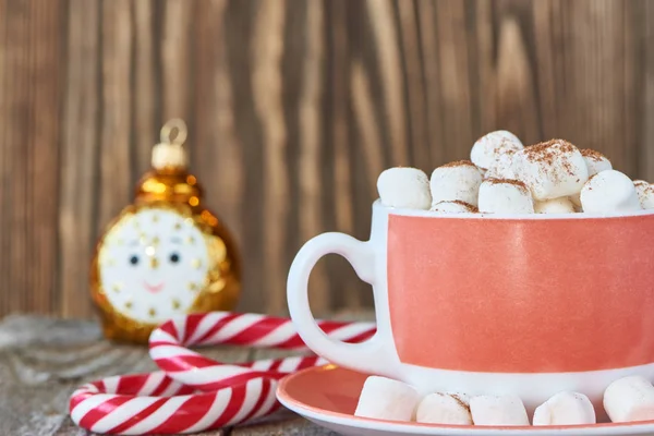 Toy alarm clock, candycane and marshmallows — Stock Photo, Image