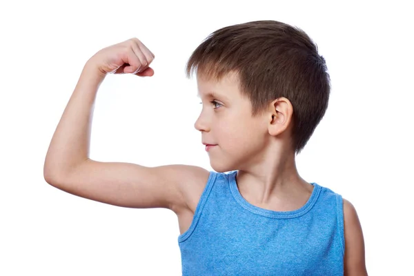 Little athletic boy looking at the biceps muscle isolated — Stock Photo, Image