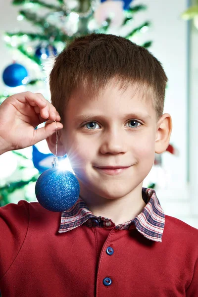 Happy child with Christmas toy ball — Stock Photo, Image