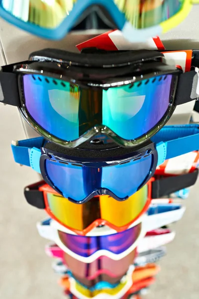 Ski goggles mask on stand in shop