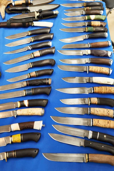 Hunting knives on blue — Stock Photo, Image