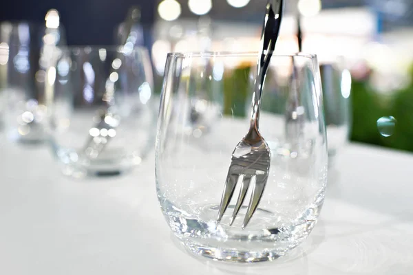 Glass with fork in cafe — Stock Photo, Image