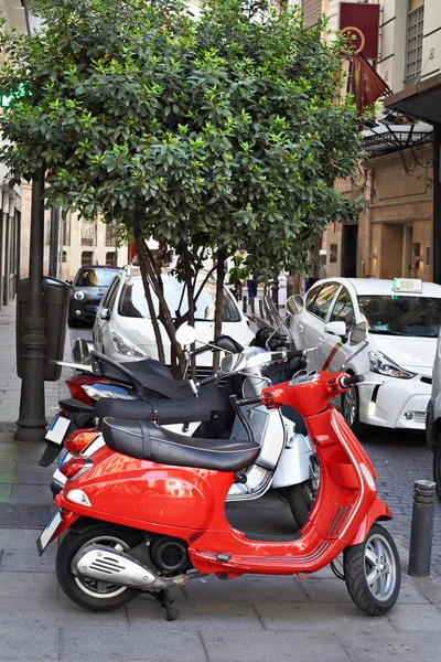 Red retro scooter on parking — Stock Photo, Image