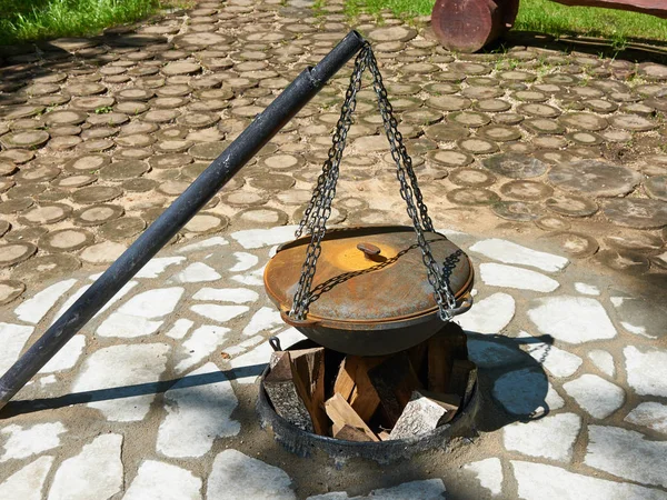 Cauldron for cooking over campfire — Stock Photo, Image