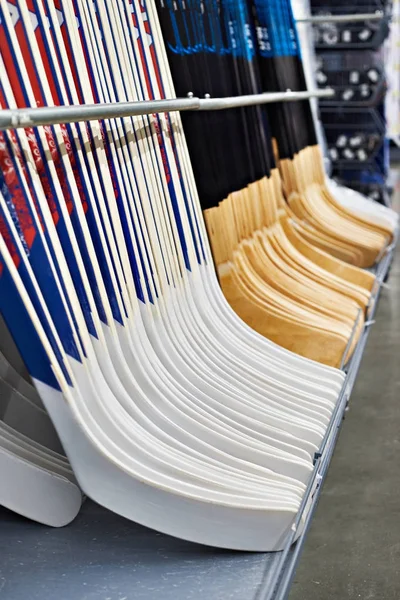 Hockey sticks in sport shop — Stock Photo, Image