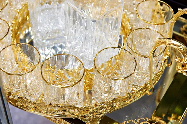 Glass cups for drinks with golden decor — Stock Photo, Image