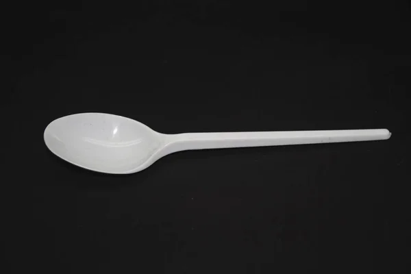 Spoon isolated on a black background — ストック写真