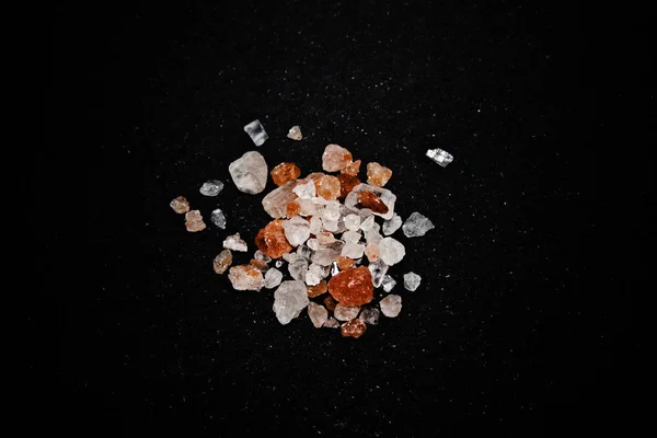 Sea salt isolated on black background — Stock Photo, Image