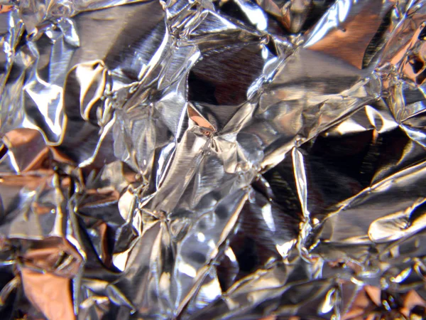 crumpled foil isolated on black background