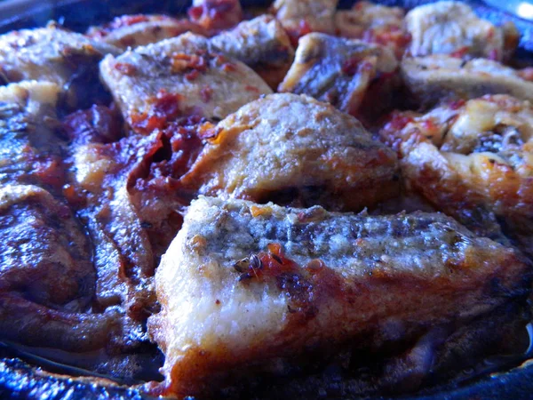 Fried meat in oil in a pan — Stock Photo, Image