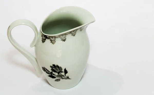 Yukarıda, beyaz bir arka plan üzerinde çiçek sanat ile bir kavanoz 45.