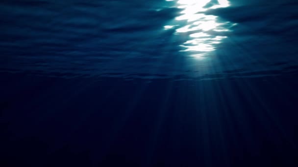 coup sous-marin des vagues océaniques oscillent et coulent avec les rayons de lumière crée un beau voile, composé de lumière du soleil. Concept de lumière sous-marine d'animation de rendu 3d en vidéo 4K .