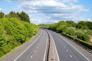 Clear motorway has no traffice in both directions. clipart