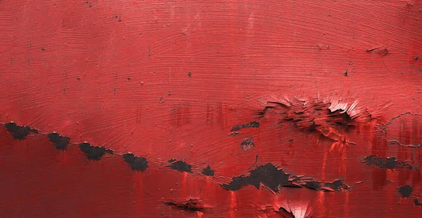 red metal texture with dents covered with rust and peeling paint