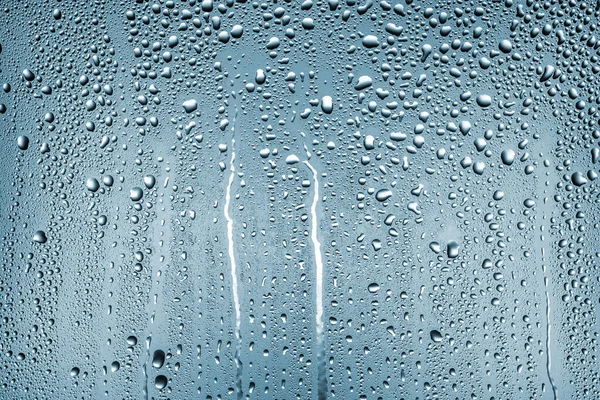 Renk gölgeli bir mat yüzeyinde büyük ve küçük su damlaları dokusu