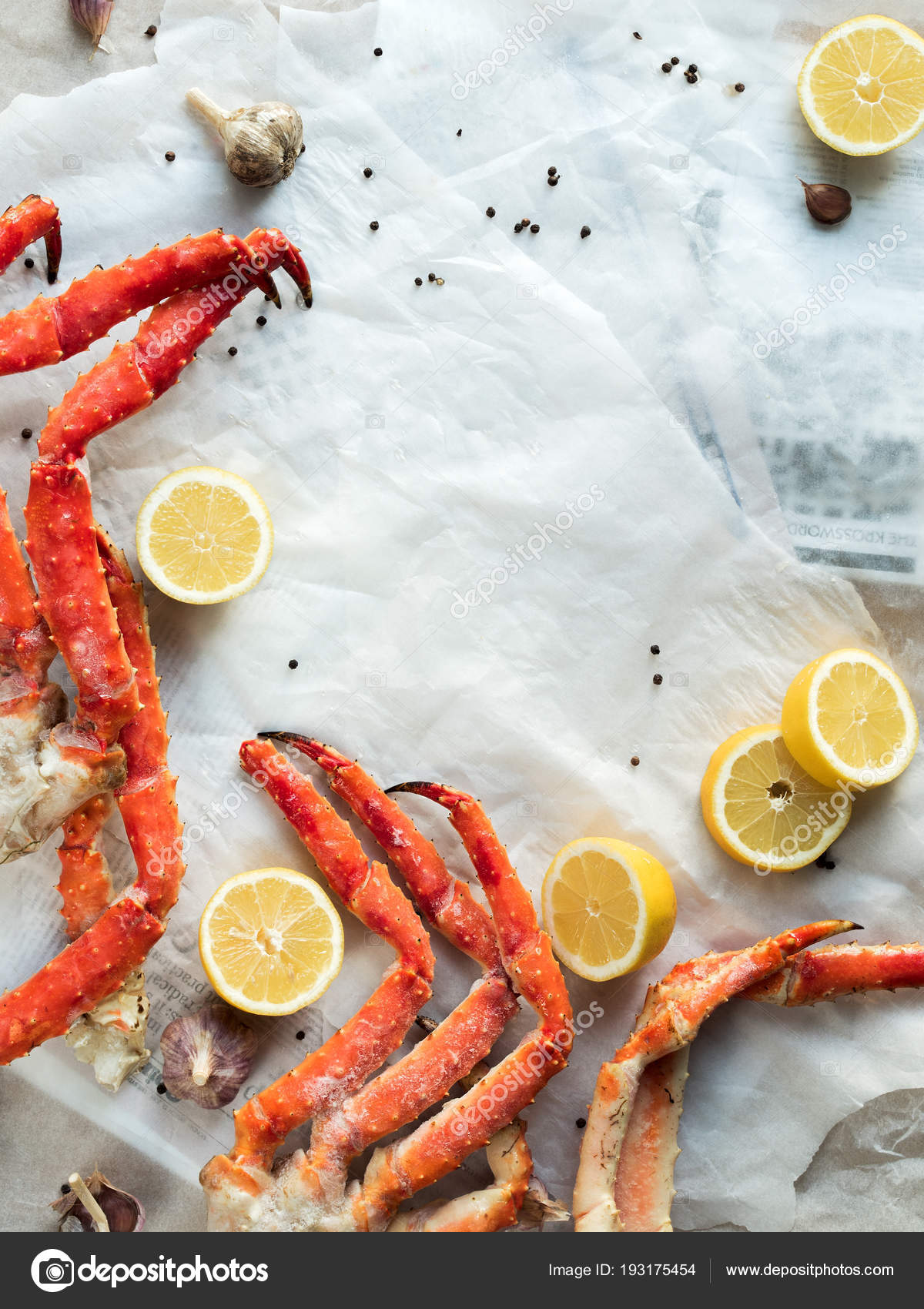 Top View Fresh Crab Legs Lemons Spices Crumpled Paper Stock Photo by ©pinkasevich 193175454