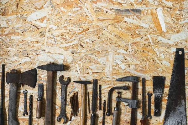 Concept Frame for happy father\'s day holiday greetings. Old carpenter construction tools on a wooden surface with an copy space.