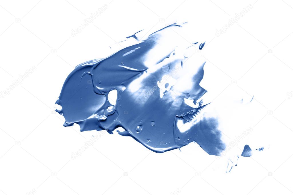 A liquid creamy texture smear of cosmetic products or acrylic paint smear of the blue classic color of the 2020 year. Cosmetic trendy background. 