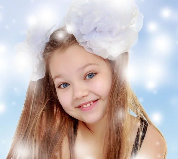 Beautiful little girl with white bows on the head — Stock Photo, Image