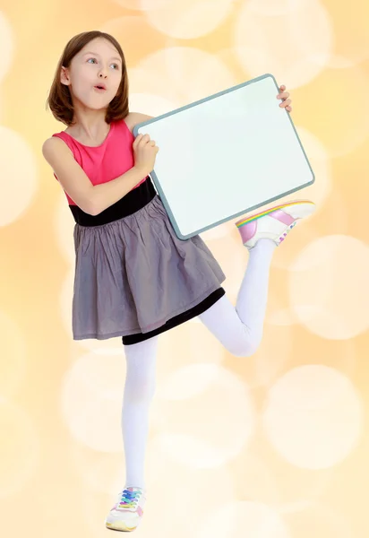 Little girl holding white poster. — Stock Photo, Image