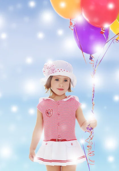 Girl holding balloons — Stock Photo, Image