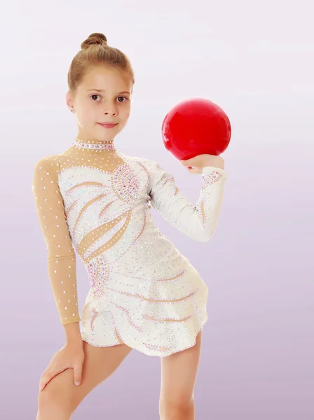 Little gymnast with a ball