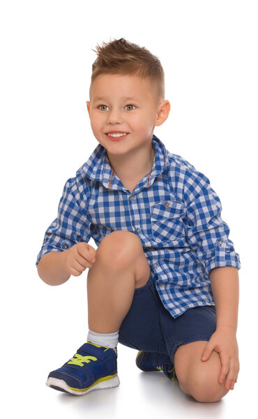 The boy lies on the floor