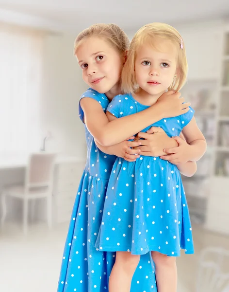 Sisters in blue dresses Stock Picture