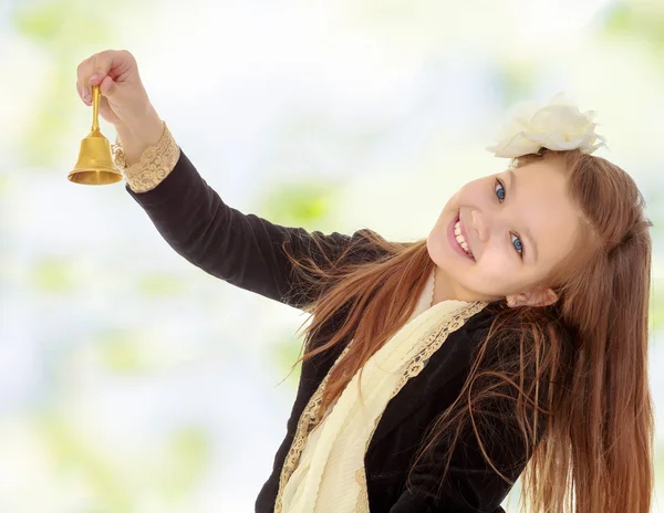 Little girl rings the bell — Stock Photo, Image