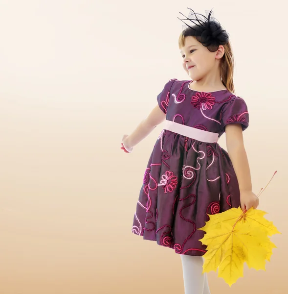 Girl with a bouquet of maple leaves — Stock Photo, Image