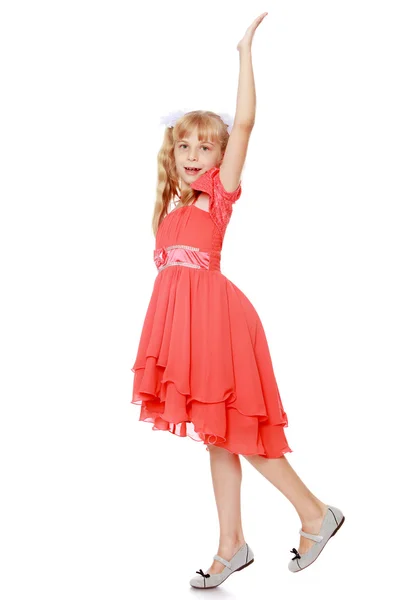 Klein meisje in oranje jurk — Stockfoto