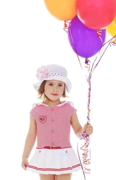 Girl holding balloons — Stock Photo, Image