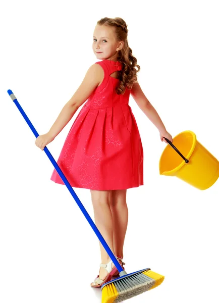 Little girl with bucket and brush cleans the house. — Stock Photo, Image