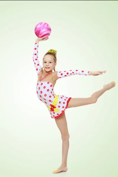 Gymnast does exercises with a ball — Stock Photo, Image