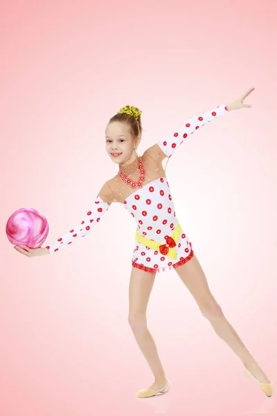 Gymnast does exercises with a ball — Stock Photo, Image