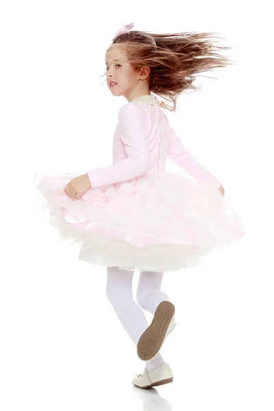 Elegant fetiță într-o rochie roz . — Fotografie, imagine de stoc